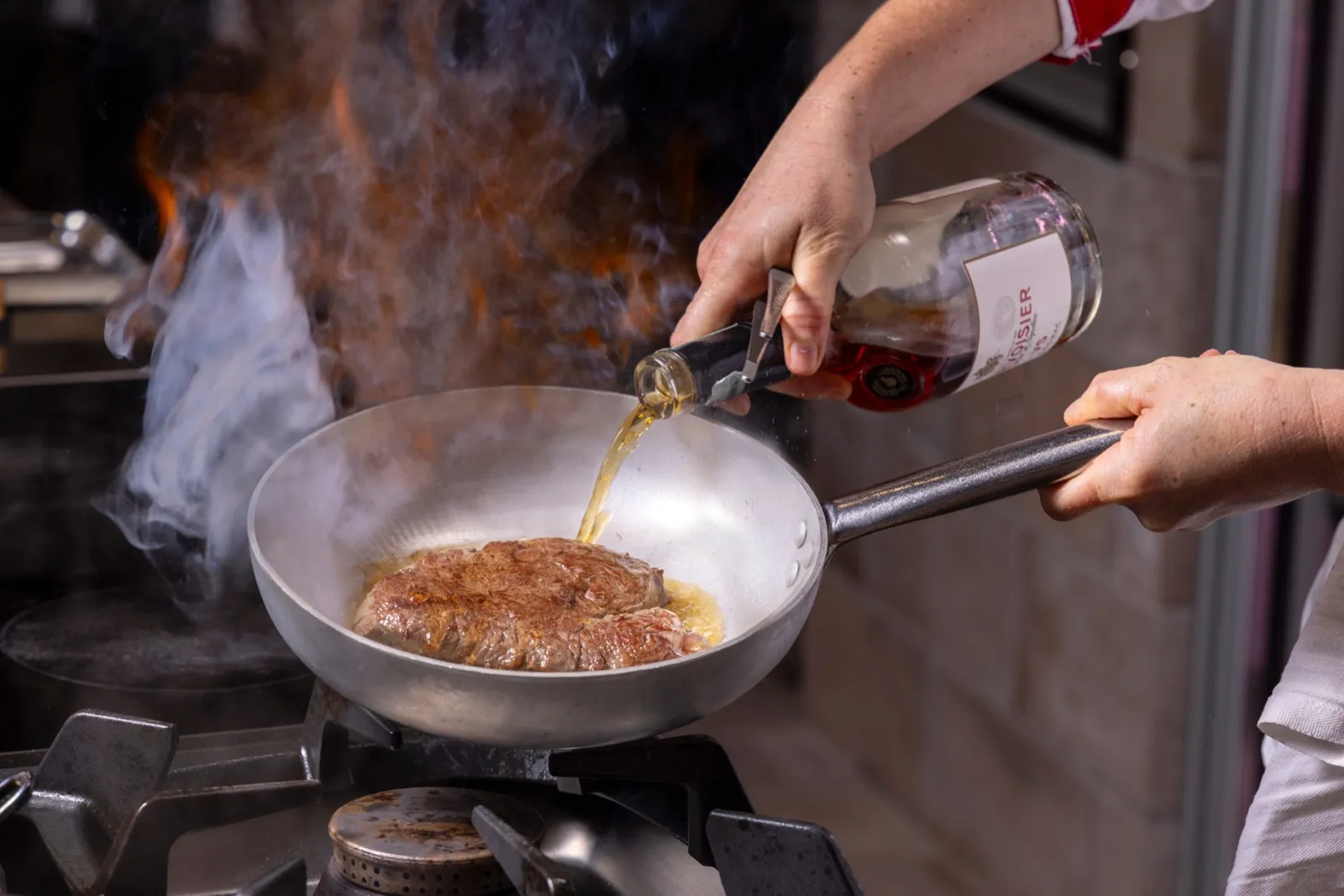 Beef filet flambéed with cognac in the kitchen